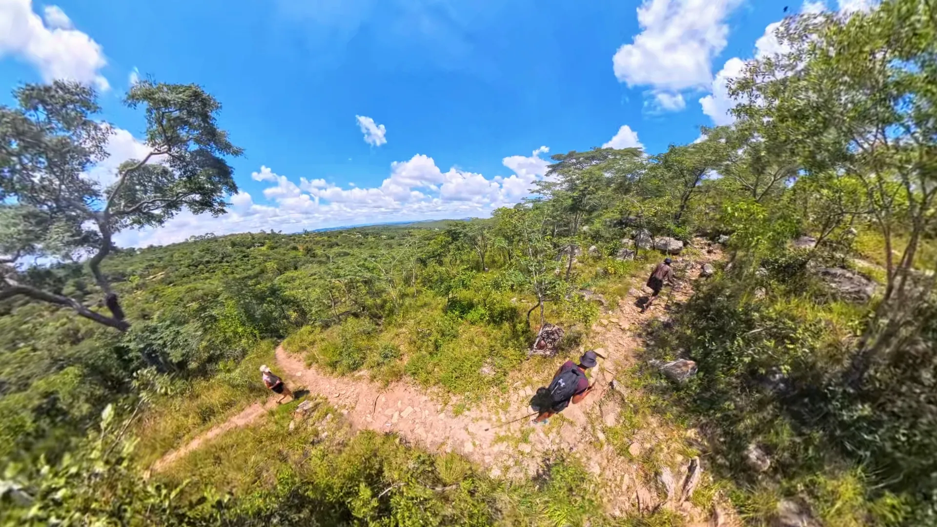 Visitors hiking the mountain trail above the village